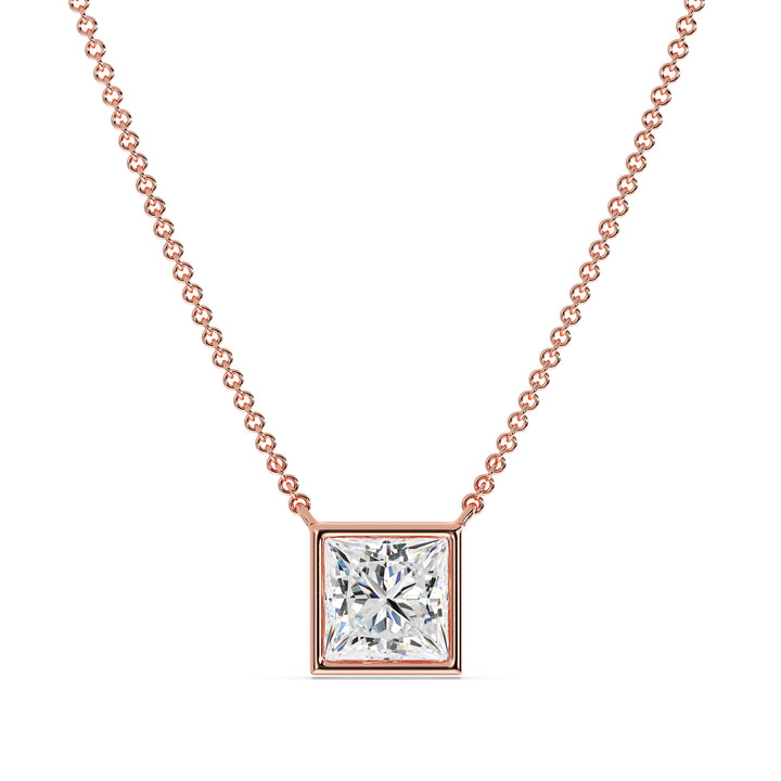 A luxurious 2 Carat Princess-Cut Lab-Grown Diamond Bezel-Set Pendant Necklace in elegant 18K Rose Gold. The E/VS IGI-Certified diamond radiates brilliance, beautifully accentuated by the romantic pinkish-gold tone of the chain and pendant