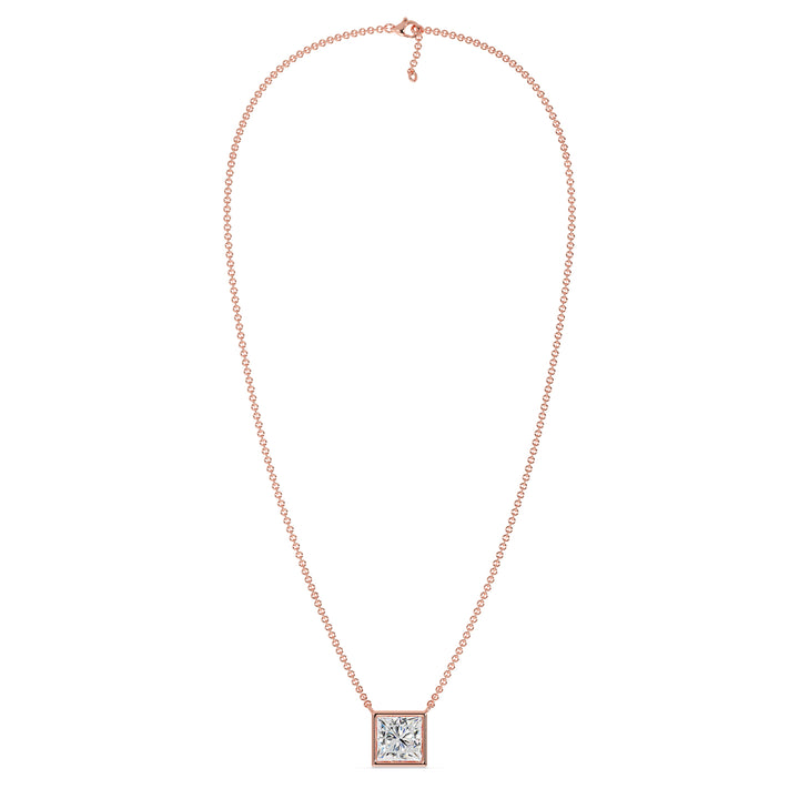 A luxurious 2 Carat Princess-Cut Lab-Grown Diamond Bezel-Set Pendant Necklace in elegant 18K Rose Gold. The E/VS IGI-Certified diamond radiates brilliance, beautifully accentuated by the romantic pinkish-gold tone of the chain and pendant