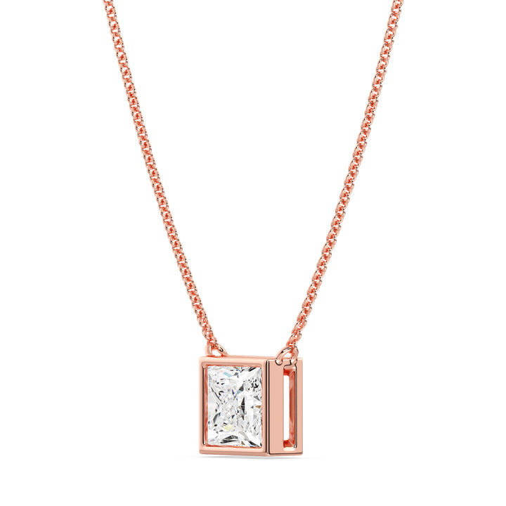 A luxurious 2 Carat Princess-Cut Lab-Grown Diamond Bezel-Set Pendant Necklace in elegant 18K Rose Gold. The E/VS IGI-Certified diamond radiates brilliance, beautifully accentuated by the romantic pinkish-gold tone of the chain and pendant
